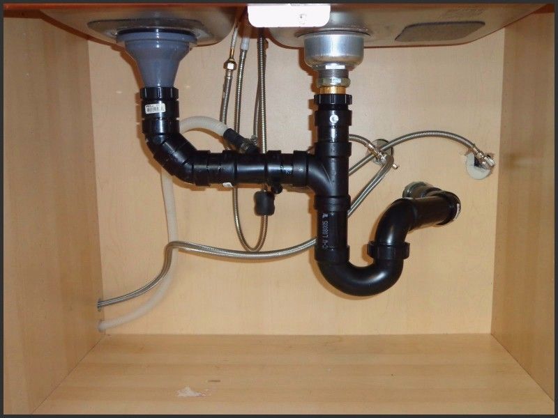 under kitchen sink trap entry